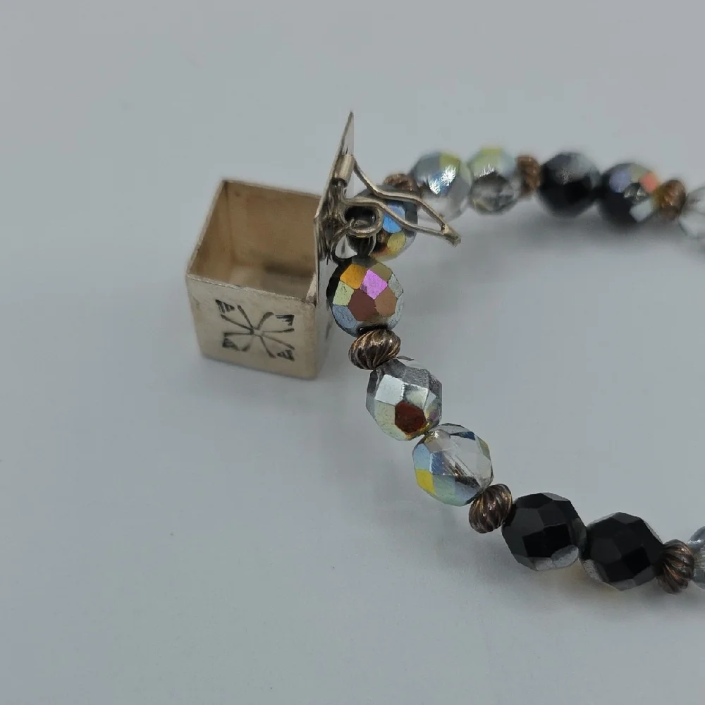 Elegant Black and Gold Charm Bracelet